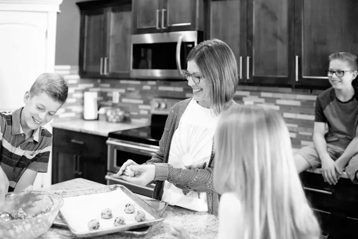 Mel and her family cooking.